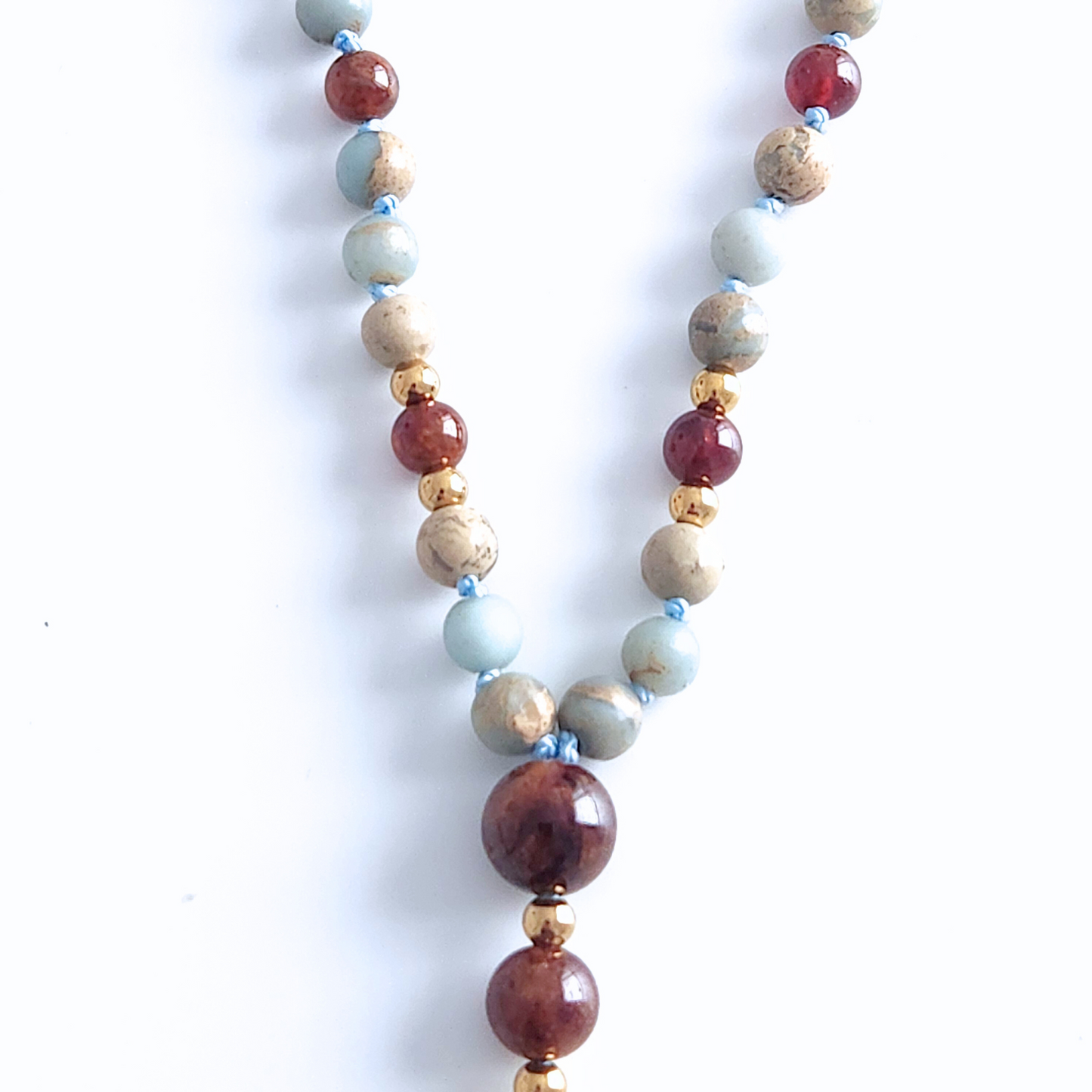 Mala en pierre naturelle de jaspe impérial et de grenat héssonite.