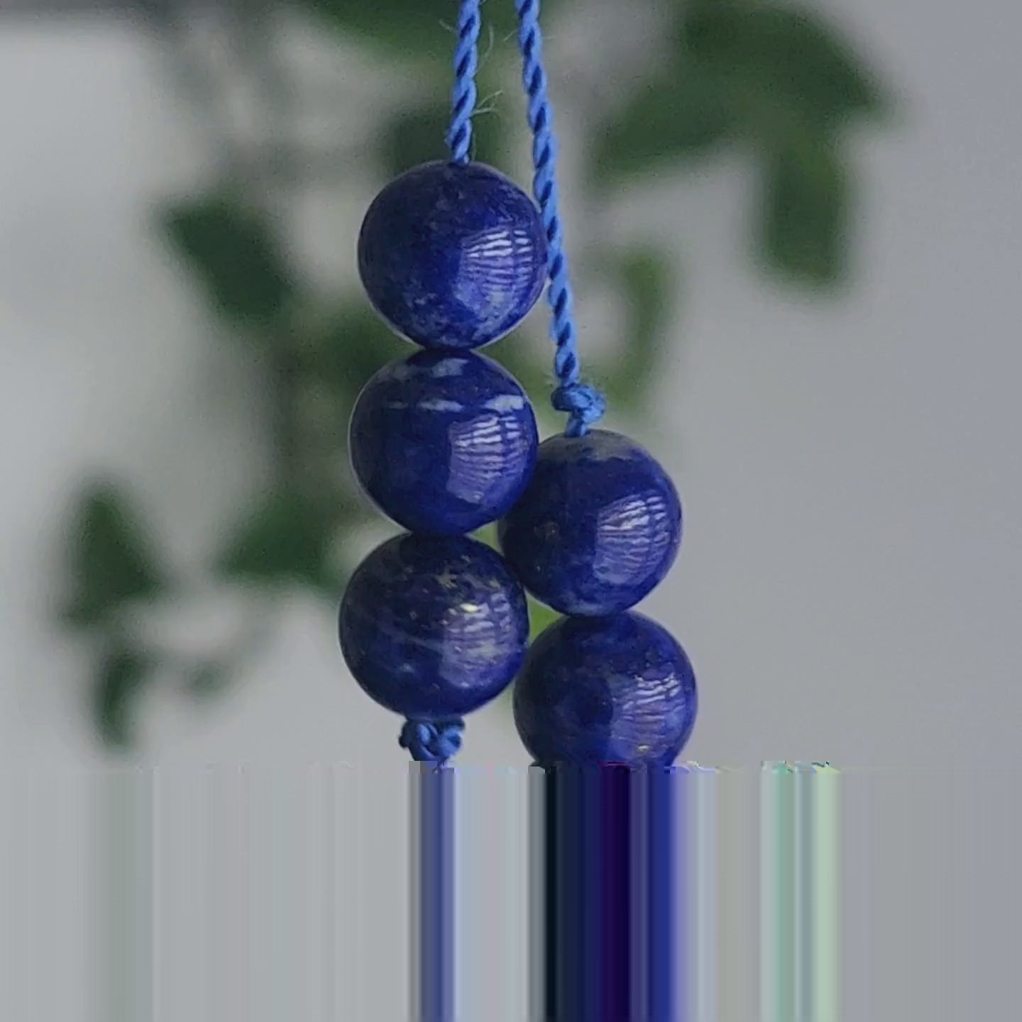 Vidéo du mini mala de poche en pierre naturelle de lapis lazuli et malachite.